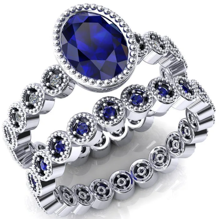 Borea Oval Blue Sapphire Full Bezel Milgrain Diamond Accent Full Eternity Ring Fire Brilliance Rings Borea Oval Blue Sapphire Full Bezel Milgrain Diamond Accent Full Eternity Ring Fire Brilliance Rings
