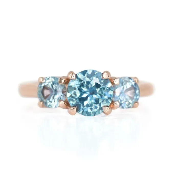 Rings Anueva Jewelry Three Stone Montana Sapphire Ring with 127ct Blue Center in 14k Rose Gold Rings Anueva Jewelry Three Stone Montana Sapphire Ring with 127ct Blue Center in 14k Rose Gold